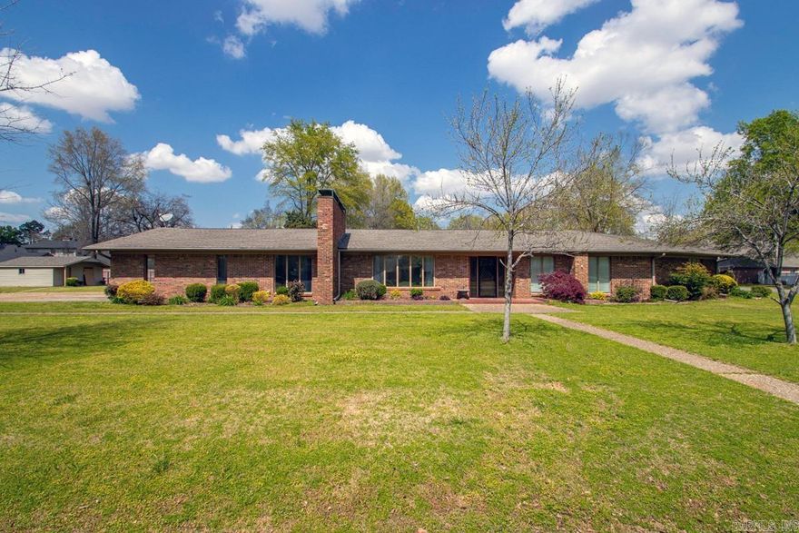 Don't miss the wonderful ranch style home in one of England's most popular subdivisions!  It's located on a double lot, with lots of double amenities! For your comfort and convenience, you'll find 2 fireplaces (one in Den & another FP in the living), 2 hot water heaters, 2 air units, a Jack and Jill style bath between the 2 guest bedrooms with 2 separate sink vanities, a separate shower and tub in the master bath with 2 sinks in the vanity and even double ovens in the kitchen!!  Plus, many of these amenities are new within the last 2 years!  Roof replaced in 2025, a new package unit 2025, new hot water tank, carpet in all bedrooms and the double oven is new as well!!