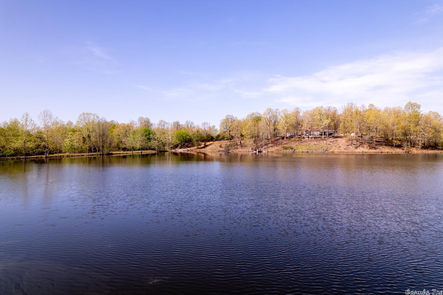 OZARKS CATTLE RANCH WITH LAKE AND CABIN NEAR SALEM ARKANSAS Property is located on Candlewood Rd, Viola, AR. This 276 acre ranch includes a 7 acre spring fed lake stocked with fish. Also has a 2 bedroom cabin that sits on the side of the lake. There is a drilled well and private septic system. High speed internet is also available with NEXT. It has approximately 230 acres of pastureland that is fenced and cross fenced. It has a year around creek, 2 springs and 5 ponds. There is a newer pipe corral and cattle working facility. Also includes an older corral. There are several vista hilltop views with great building sites. It has an abundance of wildlife including whitetail deer and turkey. Lake Norfork, Spring River and the world famous White River are all within 30-45 minutes of the property. The property has a great location and is a little over a mile off of US Hwy. 62-412 just outside of Salem. Also includes a couple of storage sheds, old farm house and outbuildings. Wild fowl including geese and ducks frequent the lake. It is not uncommon to see a Bald Eagle during winter months. Great equine property or retreat property. Near Lake Norfork, White & Spring River.