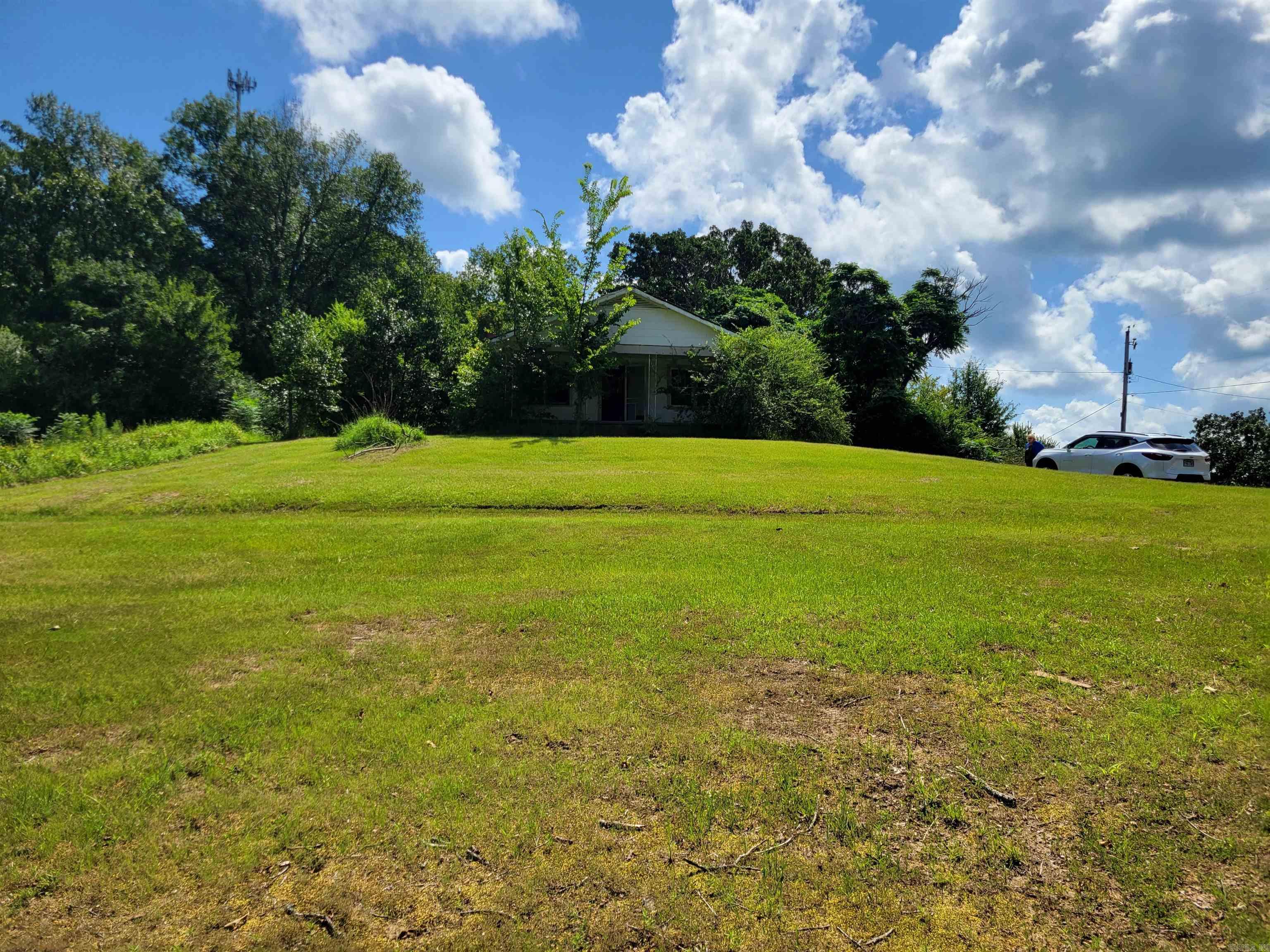 You found it!!! Your beautiful dream building site in the serene country side just 6 miles outside of Conway, AR. This 3 acre gem features the perfect location for your new home high on a hill over looking the beautiful country side. This parcel features both cleared land and forest in the same location. There is an old home on the property now, that is included with the acrage.