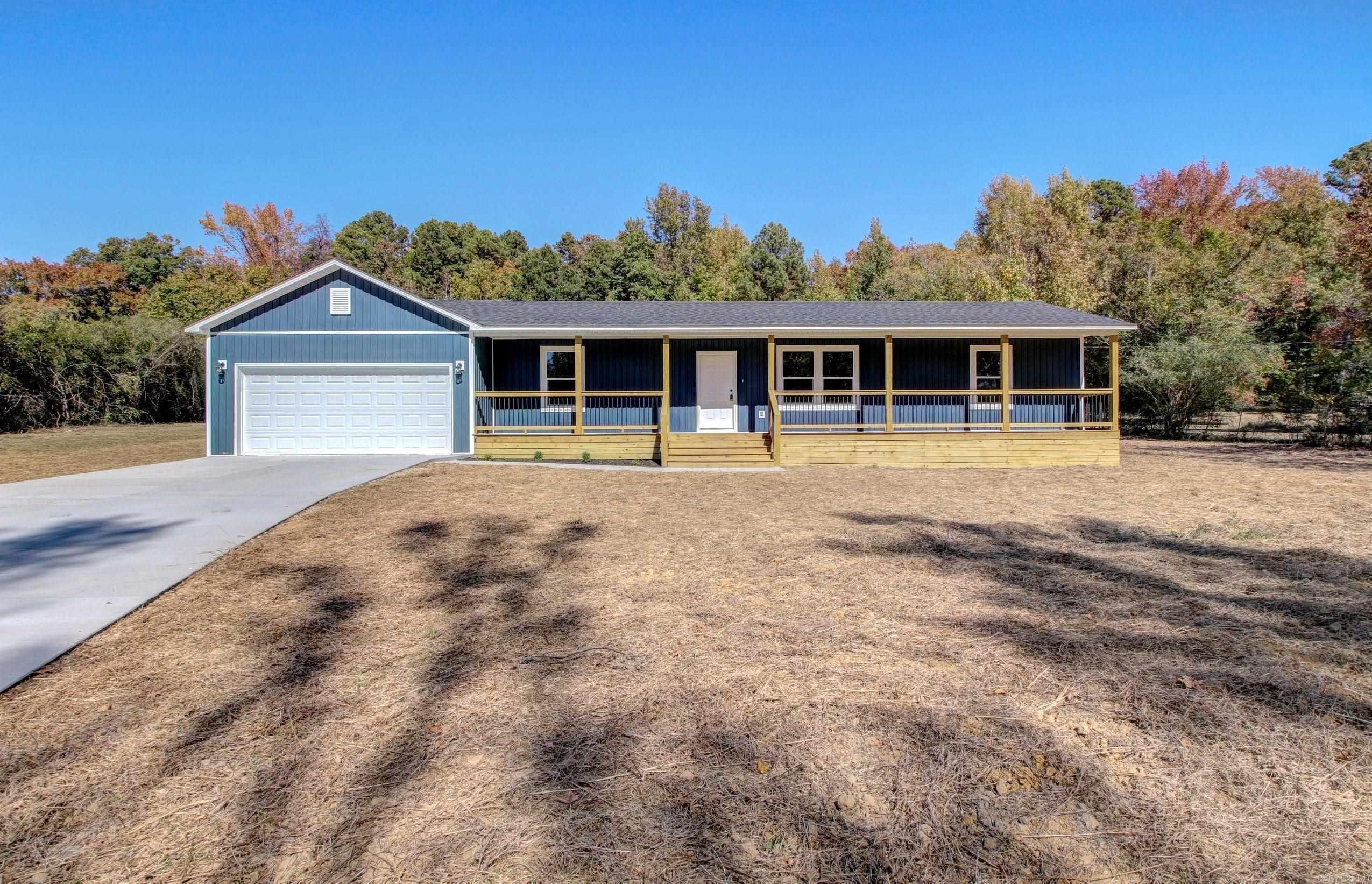 This beautiful fully renovated home located just outside of town on a little over an acre is the perfect place to call home. The all-new front porch spans the length of the home and welcomes you inside. With an open concept living space this makes a perfect place to entertain or cozy up the beautiful electric fireplace that is flanked by an attractive accent wall. No stone was left unturned with new septic, city water to house, new roof, HVAC (including ductwork), new sheetrock, faucets, fixtures, insulation, new fencing, brand new kitchen including SS appliances, all new bathrooms, all new electrical and plumbing, and much more. The property can be accessed from the main road via a newly poured concrete driveway, or from the rear via Angela drive. Storage shed shall convey and the seller left the well to access for lawn maintenance or to add a sprinkler system. The property is turn-key ready for you to move in... Just in time to celebrate Christmas in your amazing home!!