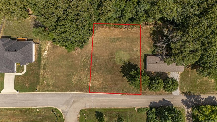 Building lot available on Johnwood right next to newer homes on Rockport. Great opportunity to build your next home. Sloping lot lends to a great basement walkout, or fill and have a slab like others nearby. All city utilities available — sewer, water, and electric already on the property. Two lots side by side if you want a large spot to build.