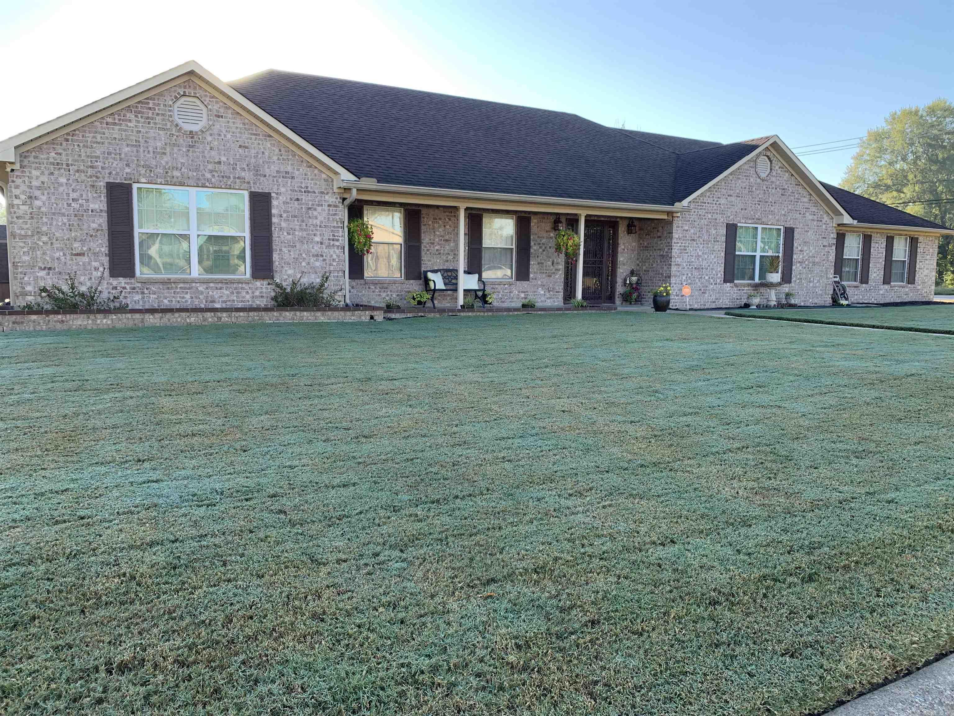 Come see this spacious full brick home on a corner lot with beautiful curb appeal in Pecan Lake! This 2644 sqft., 4 bed/3 full bath home boasts large common living spaces with a cozy fireplace. Front living space may be used as a dining room or another living room area based on the buyers' needs or desires. The kitchen with dark stained wood cabinets has stainless steel appliances, dishwasher and trash compactor. The home is equipped with a central vac unit. Laundry room has a sink, cabinets and space for extra fridge or freezer. Master bedroom is apart from 3 guest rooms and master bath with jetted tub, separate shower and double walk-in closets. The family room has double doors that lead to the patio. The large, covered patio has 2 ceiling fans to provide light & to keep you comfortable. Security doors and windows all around. Sizeable outdoor storage unit for your convenience. Close to Brodie Creek Park which has picnic tables, grills, playground, basketball court and a walking path. Quiet and friendly neighborhood. Bring your buyers and let's make a deal!