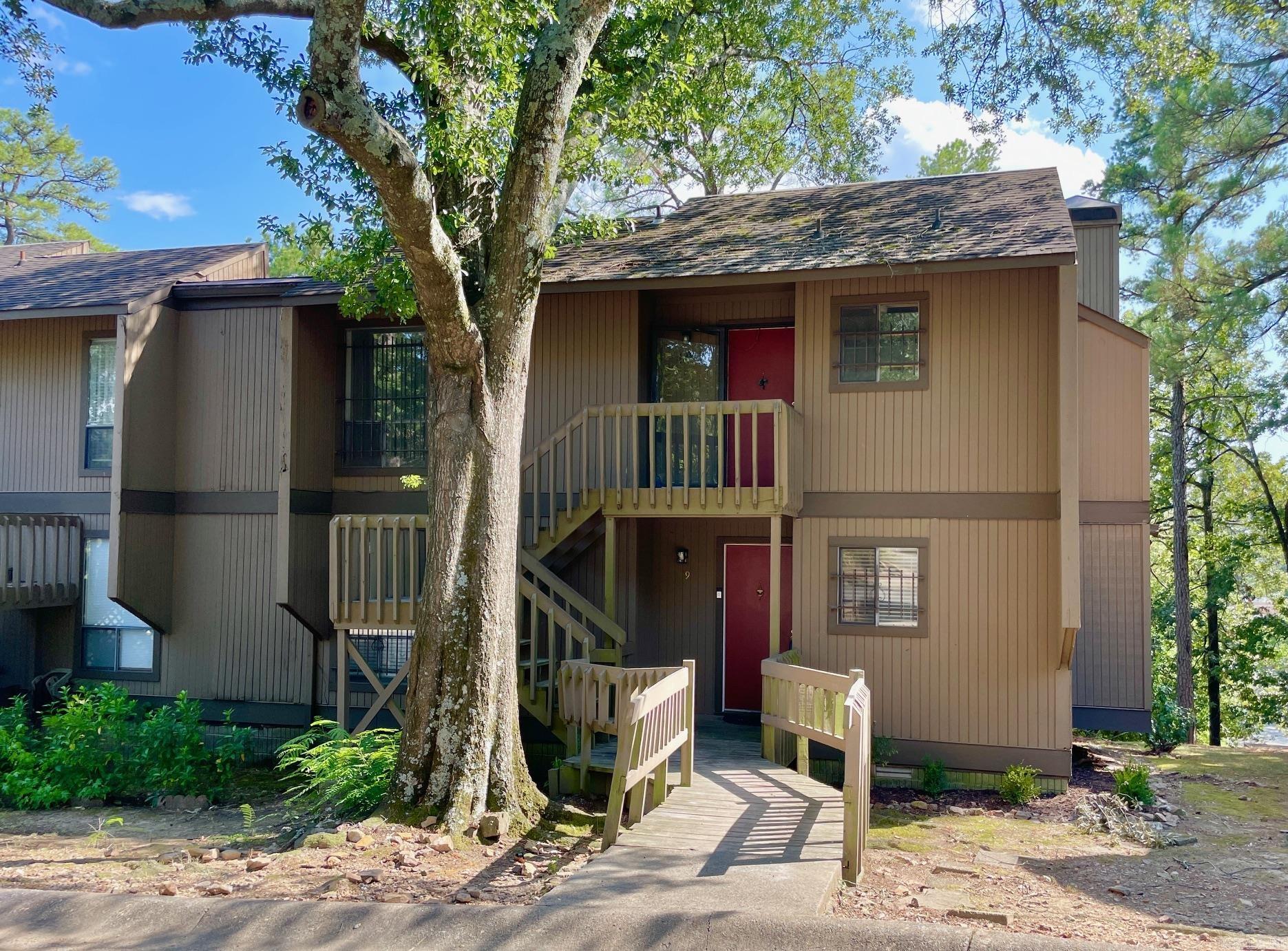 Opportunity awaits with this spacious Forest Hill 2 bed, 2 bath condo with a large living area, fireplace, side deck with storage and extended deck off the back. Upper unit with 1062+/- square feet that makes you feel like you're in a treehouse. Priced to allow for renovations and upgrades, this condo has the potential to be a beautiful space for someone or for a profitable investment property. Great location close to Heights and Hillcrest shopping and restaurants. Water heater was replaced in 2023. With an acceptable offer, seller will pay the 2026 Roofing Assessment of $3300. Old carpet and tack strips have been removed.