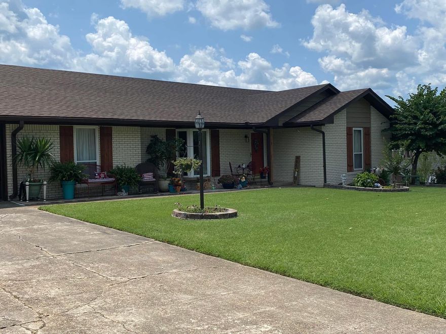 Motivated seller! Beautiful updated ranch home located in desirable Wiley Subdivision in Piggott, AR. Pride of ownership shows in this incredible home! This 3 bedroom, 2 1/2 bath home has 2003 sq ft and is move in ready! There are numerous updates including hardwood flooring (Scraped Hickory) in the living room, office and hallway, kitchen remodel (flooring, solid surface countertops,  sink, backsplash, stove, microwave,  dishwasher), crown molding, and both baths  have been updated too! Roof was replaced in  (approx 2022), Heating and Air was replaced in approx 2024, and water heater 2022! Windows were replaced in 2001, Garage door replaced in 2006. This home sits on .51 acre with a shop (14 x 18 added in 2019),  and has an additional work shop! The backyard is an entertainers dream! Enjoy hosting family gatherings or sitting back and relaxing on the deck. This outdoor living space will not disappoint! There's also an incredible sunroom that offers abundance of natural light and has a gas stove. You will enjoy spending time in this incredible space! Read a book on a rainy day or enjoy watching ballgames and hanging out! What else could you want...This home really does have it all!