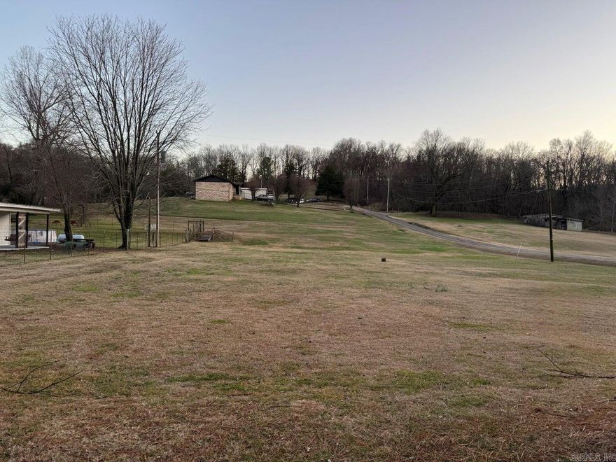 No restrictions! Nice level lot just ready for you to build, bring a RV or move in a manufactured home. Land already has septic and Phifer water with electric at the road. As a bonus there is already a storm shelter in place.  Owner financing available available with acceptable terms.