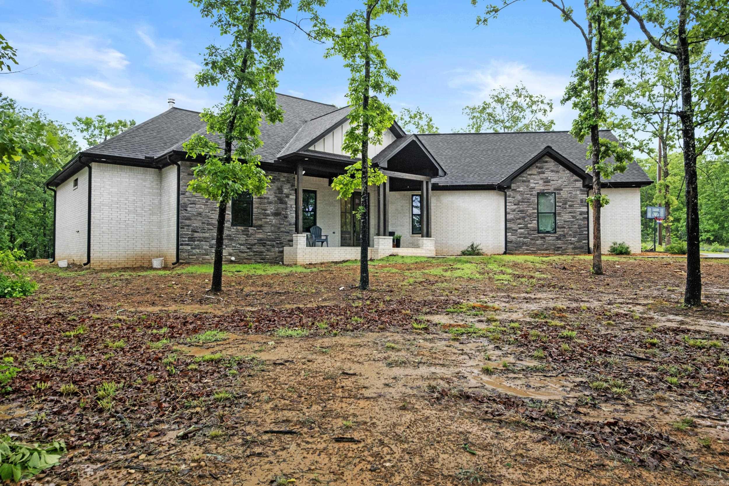 Practically New Construction modern farmhouse on 3.25acres. Great split floor plan. 4bed, 2.5bath, with a flex room that can be formal dining, an office, or a 5th bedroom. Coming in through the custom double doors you'll find hardwood floors and vaulted ceilings. Open floor plan kitchen. Custom cabinets throughout. Can lights added in every room for maximum lighting. Large walk in closets throughout. Covered back patio. This is a dream home!!