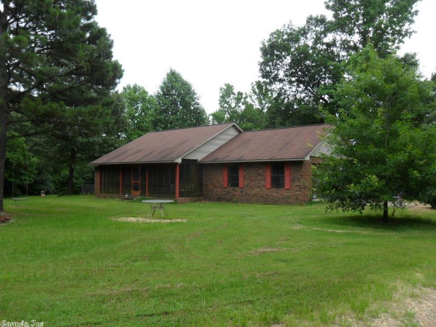 Parcel has 15.31 acres with abundance of deer. 1757 square foot Brick home has open floor plan with central heat and air, 3 bedrooms, 2 baths, cathedral ceilings in living room,  nice kitchen with all your amenities and a garage for parking and storage. Outside there is a seasonal creek with a bridge over it, and a 10x16 storage building.