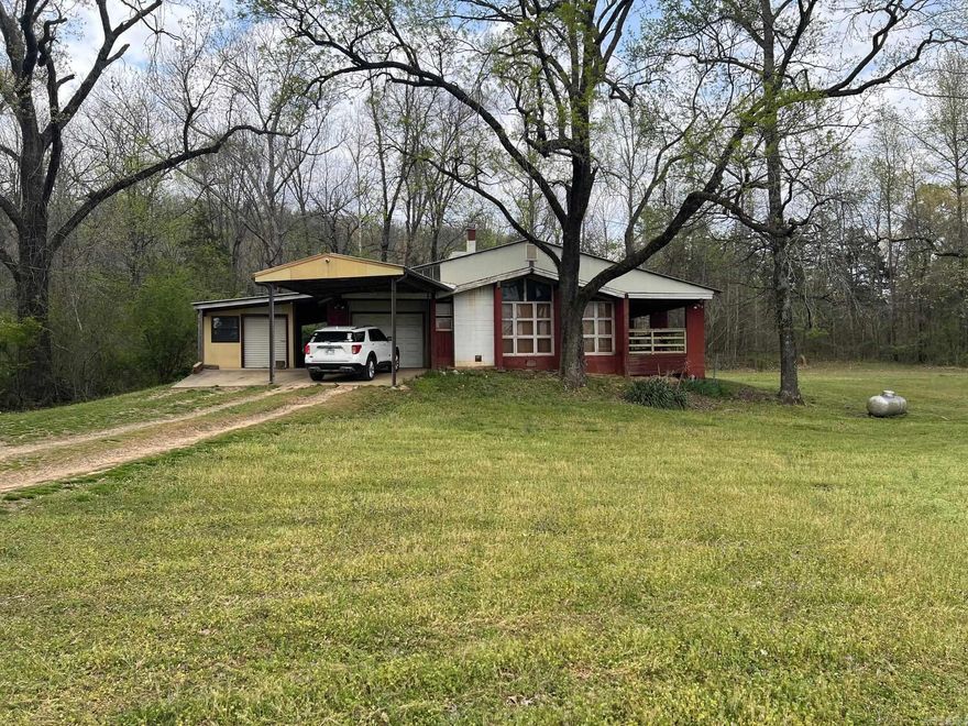 Mineral Rights Convey 40 Acre homestead sitting at the base of Tucker Mountain in Conway County Arkansas. House is a 2 bedroom 1 bath. Has a one car garage and separate workshop. Wood burning stove.  House overlooks a meadow. Nice private location