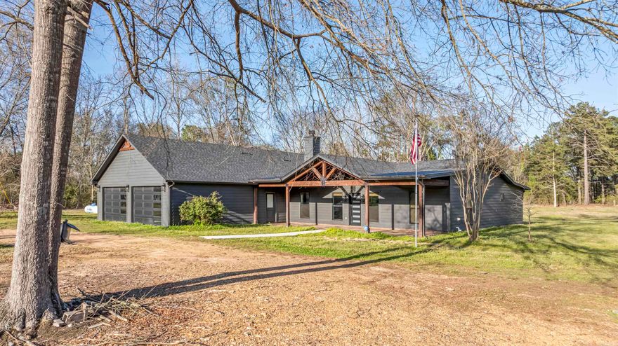 Completely remodeled by Eppinette Construction, this stunning modern home sits on 4.14 acres in Winthrop, AR and offers 2,809 sq ft of thoughtfully designed living space. Featuring 3 bedrooms, 2 full baths, the open-concept floor plan is ideal for both everyday living and entertaining, with a spacious living area highlighted by a gas log fireplace. The kitchen showcases a large quartz island, GE Café appliances, breakfast/bar seating, and space for formal dining. The split layout provides privacy for the main En-suite, which includes a spa-like bathroom with a soaking tub, oversized walk-in shower, and a generous walk-in closet with a built-in secure room that can serve as a storm shelter or safe. Luxury plank flooring flows throughout the home with ceramic tile in the bathrooms. An oversized garage leads into a mudroom with ample storage. Built-in stereo system that extends throughout the home, garage, and covered back patio, along with the added peace of mind of a whole-home Generac generator. The property also features an impressive 2,000 sq ft shop with an apartment: kitchen, 1 full bath, Bedroom, Dining, washer-dryer hookup, and has its own private drive for guests or rental.