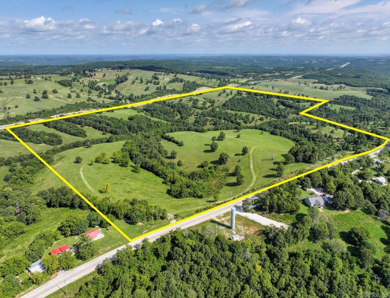 Located close to the Missouri Border. Rolling pastures and Hwy 65 frontage. Utilities in place or proposed subdivision. Rolling hills and vista views. Two entry points to Old Hwy 65. Large scale residential development opportunity. 3+ acre lots pre-plated. Utilities including water ran through property or home sites. Minutes from Branson.