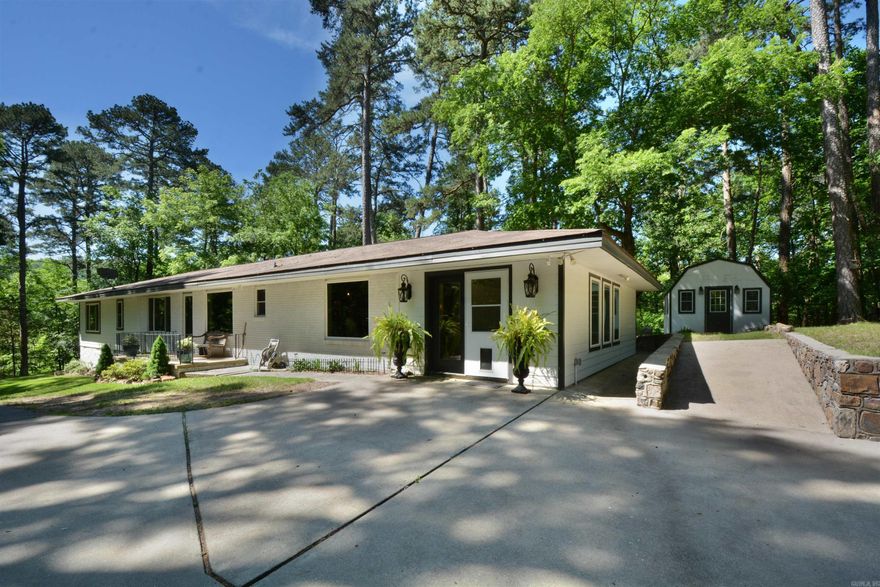 VERY SECLUDED--UPDATED BRICK HOME IN DOWNTOWN HOT SPRINGS, (OFF WHITTINGTON AVE) SITTING ON 1.3 ACRES, GATED, ELEGANT STONE WALL DRIVEWAY- PROPERTY BACKS UP NEAR NATIONAL PARK--JUST MINUTES FROM DOWNTOWN--TOTALLY REMODELED --KITCHEN WITH GRANITE COUNTER TOPS, NEWER CABINETS, LUXURY LAMINATE FLOORING, STAINLESS STEEL APPLIANCES, GOURMET GAS RANGE, OPEN FLOOR PLAN LIVING ROOM RIGHT OFF THE KITCHEN & GAS LOG FP, MAN CAVE/ THEATRE ROOM (12 X 22) COULD BE 5TH BEDROOM, MASTER SUITE WITH TREY CEILING, HICKORY FLOORS, MASTER BATH WITH DOUBLE SINKS, JACUZZI TUB, LARGE TILE SHOWER, COVERED PORCH OFF MASTER SUITE WITH STORM SHELTER UNDER MASTER PORCH (7 X 10)  -OFFICE & WORKOUT BUILDING  (SEPERATE BUILDING) FROM THE HOUSE  COME VIEW THIS EXCEPTIONAL PROPERTY WHICH IS A RARE FIND.