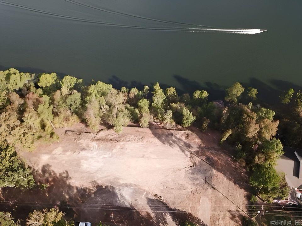 INVESTOR OR PRIMARY... 395' on main channel with good deep year round water$659,900!! 2.58 acres on beautiful Lake Hamilton with scenic views and several building sites or divide and sell lots or build additional homes; end of circle driveway goes all way to lake - be careful when either walking or driving; rough but very walkable; survey on file; many possibilities for this 2.58 acres and large lake frontage!! all underground city utilities once serviced 7,000+sf home