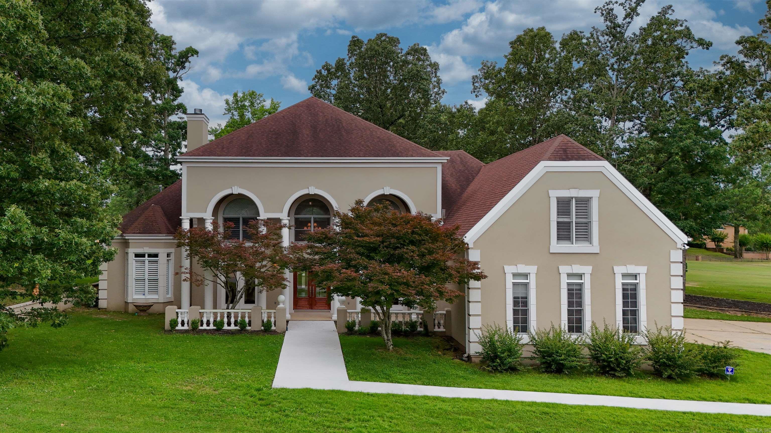This beautifully renovated home, located on the 16th hole of Ridgepoint Country Club, offers breathtaking views and an abundance of natural light through its impressive two-story windows, complemented by mechanical blinds and custom plantation shutters throughout. With approximately 6,500 square feet of living space, this spacious residence is perfect for accommodating the entire family. The home boasts 5 bedrooms and 6 bathrooms, including a luxurious master suite that serves as a personal oasis, complemented by a spa-like master bath. In addition to the generous living spaces, there is a dedicated office and a versatile office/studio with its own private entrance, ideal for working from home or creative pursuits. Tastefully redone in 2023, this home combines modern elegance with comfort, providing ample room for family gatherings and entertainment. Don't miss this opportunity to own a slice of paradise at Ridgepointe Country Club.