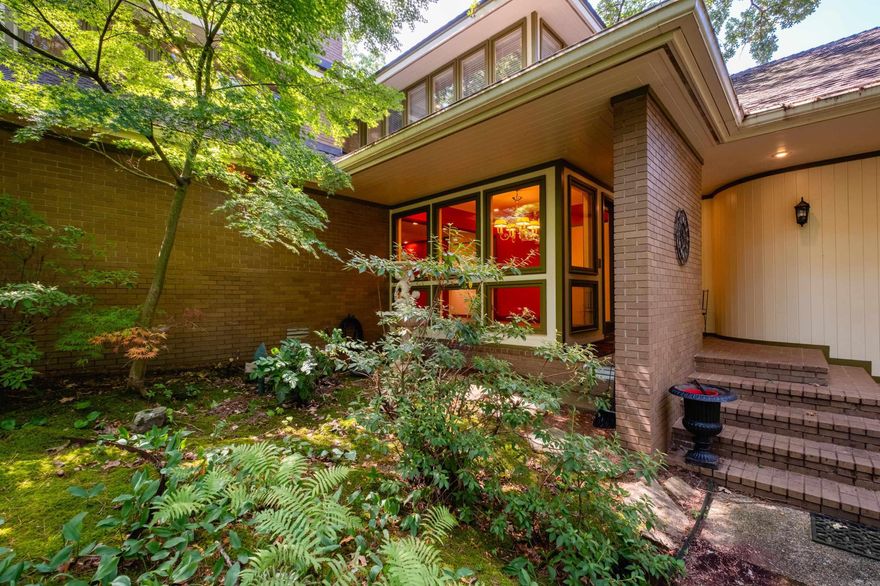 Discover a rare opportunity to own a truly distinctive estate in the secure & highly sought-after enclave of Hickory Hills. Expertly built by Gary France & thoughtfully designed by a Chicago architect, this elegant three-story residence rests on a sprawling 1.63-acre lot, offering exceptional privacy, scale, & sophistication. The main level features a serene primary suite with peaceful views & a spa-inspired bath, formal dining room, & a sun-filled great room anchored by a handsome fireplace & expansive picture windows framing the natural surroundings. The gourmet kitchen is a chef’s delight, appointed with premium stainless Miele and Wolf appliances, a Sub-Zero refrigerator. An oversized deck extends the living space outdoors, overlooking the beautifully landscaped backyard and sparkling pool. The upper level offers two generously sized bedrooms & a versatile bonus room. The lower level includes a welcoming den with wet bar, an additional bedroom & bath, a flexible bonus space ideal for teens or guests. Garage parking for up to eight vehicles, which could be transformed into a guest house, as it's currently plumbed for HVAC, washer/dryer hookups, electrical and plumbing.