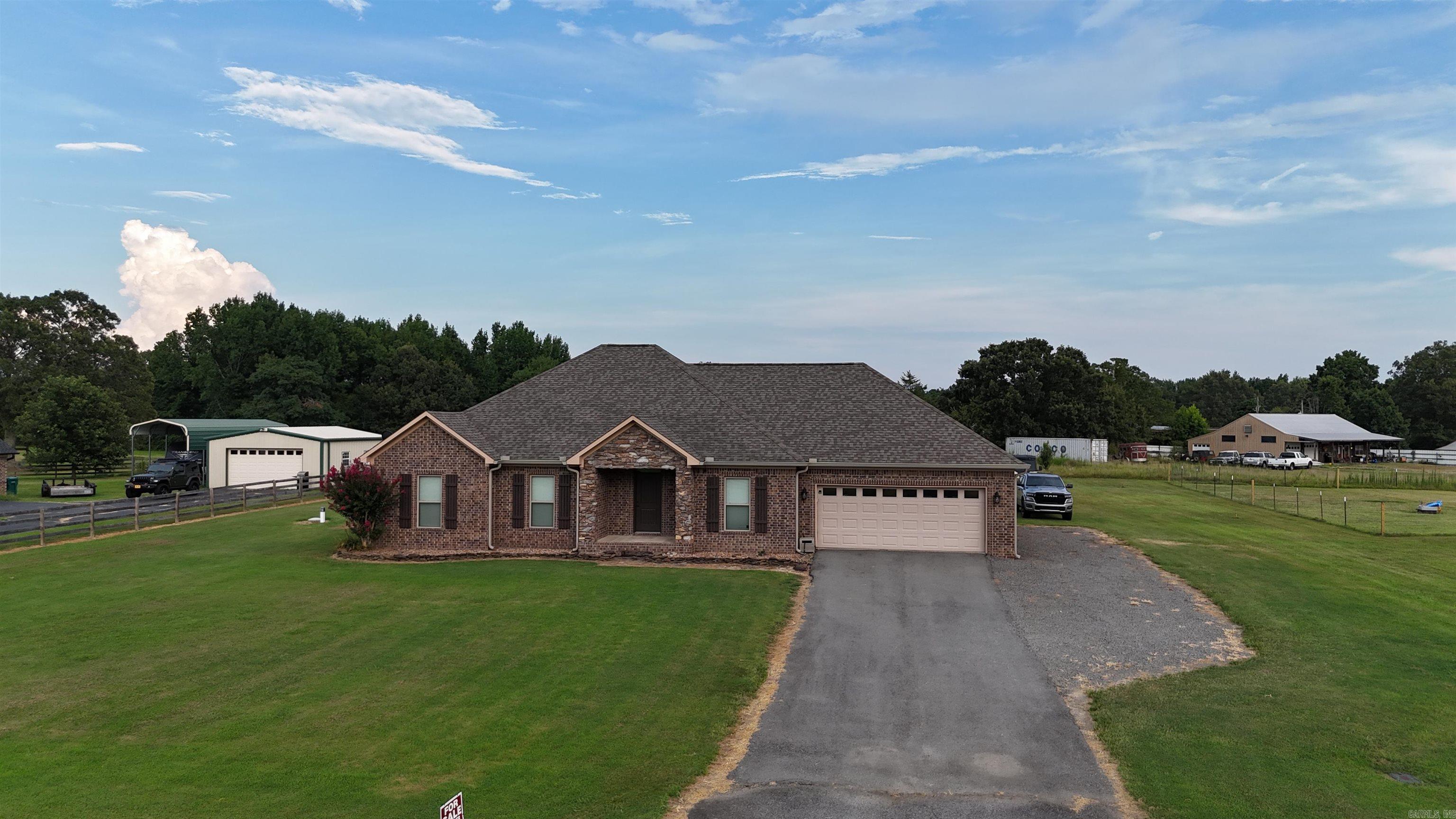 Beautiful 4-bedroom home with vaulted ceilings and a great floor plan. From the nice rock work on the outside of the home to the wooden ceiling beams inside, everything about this home is modern and stylish. Large master bedroom features a good size walk-in closet and a master bath with a big bathtub. There is plenty of yard space on this 1-acre lot. This home is in the perfect location for anyone wanting to live a more rural lifestyle while still easily being able to commute to Greenbrier or Conway.