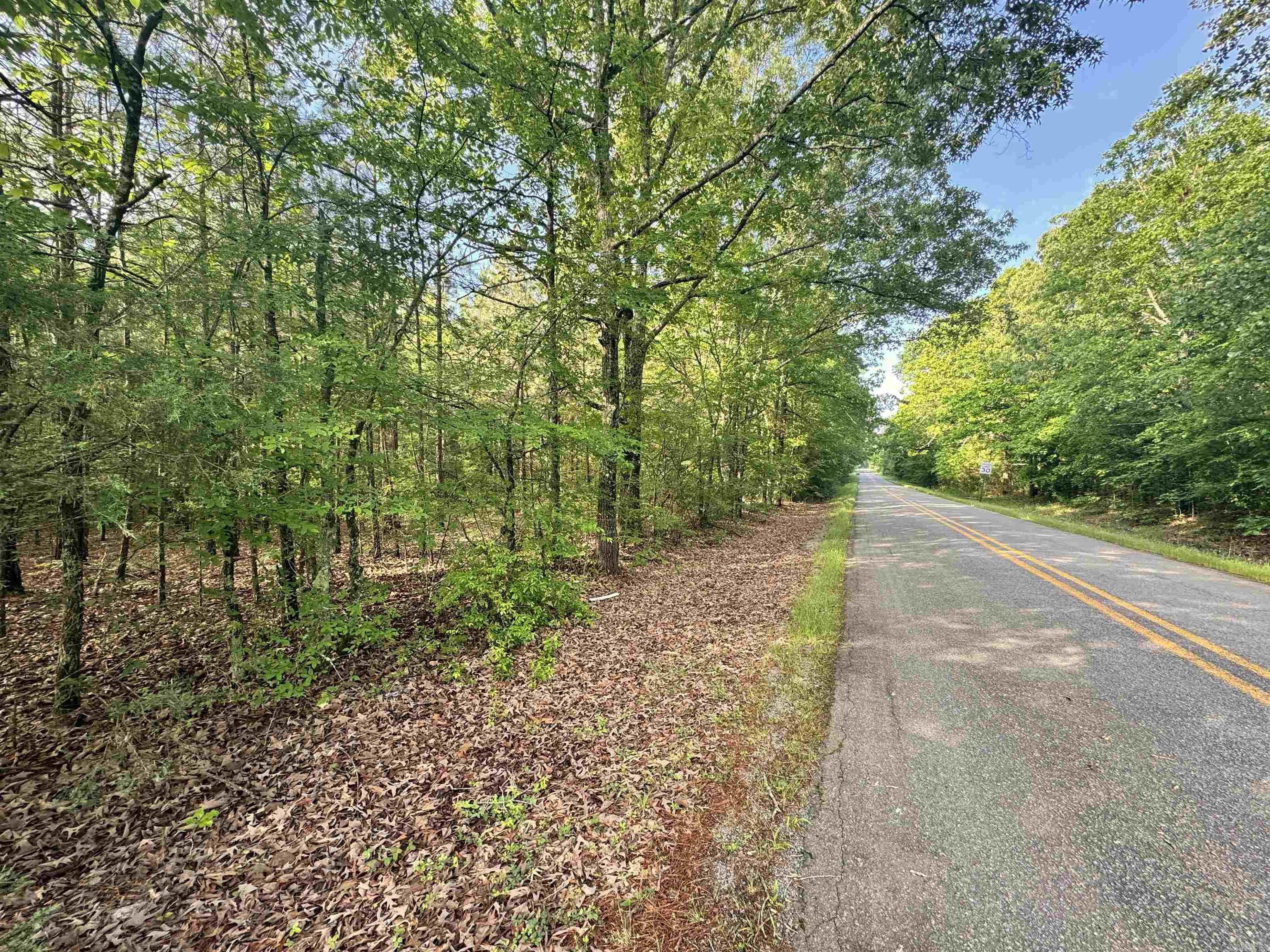 If you are looking for a place to build your dream, custom home in Central Arkansas look no further. This tract located just West of Cabot, Arkansas in Pulaski County and has water and electric readily available. The property is currently fully wooded providing a blank canvas for you to develop however you would like. There is a wet weather creek that cuts through the property providing an opportunity to have a water feature planned into the landscaping of your build. This would also make a great investment tract whether to park some cash and hold for several years or to split into multiple custom home sites and resale. The timber on this tract consists of mixed hardwoods and pine. There are areas of mature pine and hardwood while other areas are mostly smaller trees indicating that it was once a field or pasture. It is a very flat piece making it extremely efficient to build on.