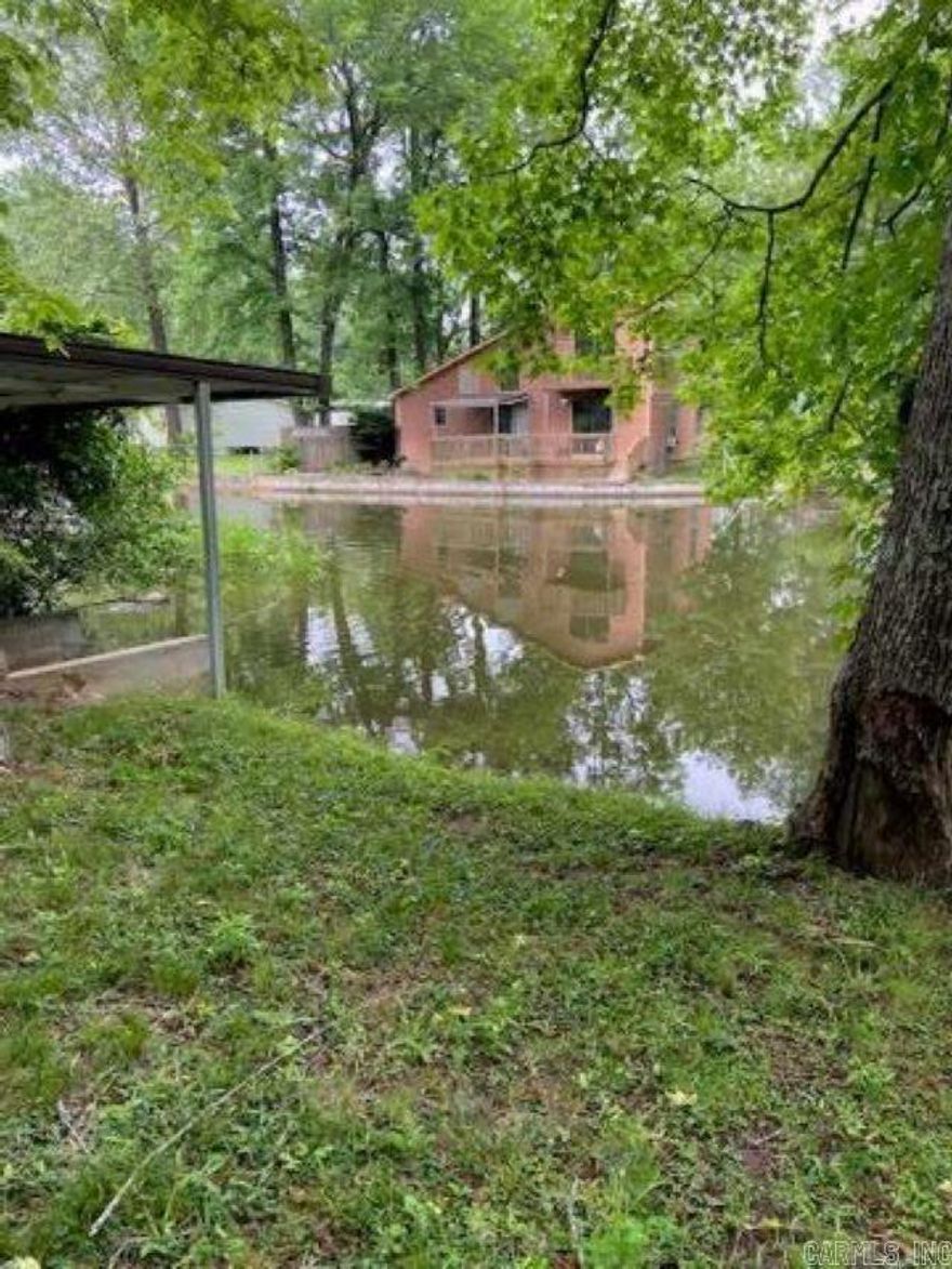 water frontage, google up to see location on Lake Hamilton, boat dock, As Is, Fixer upper, but could be very nice. Almost impossible to find anything under $200,000 on the water.  Sign and lokbox are there.
