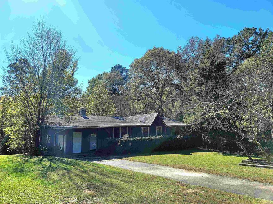 Country Living with a Creek! Take a look at this 2 acre parcel located near Lake DeGray! Home needs a little TLC but has a lot of potential! Lots of outdoor space with 2 storage buildings to convey and it has a paved driveway. You will love the fireplace accenting the living room wall. It has a bonus porch that was closed in off the back and did I mention the creek running through the back! Sit and relax and take in all the nature this property has to offer. Priced to move, schedule a showing today!