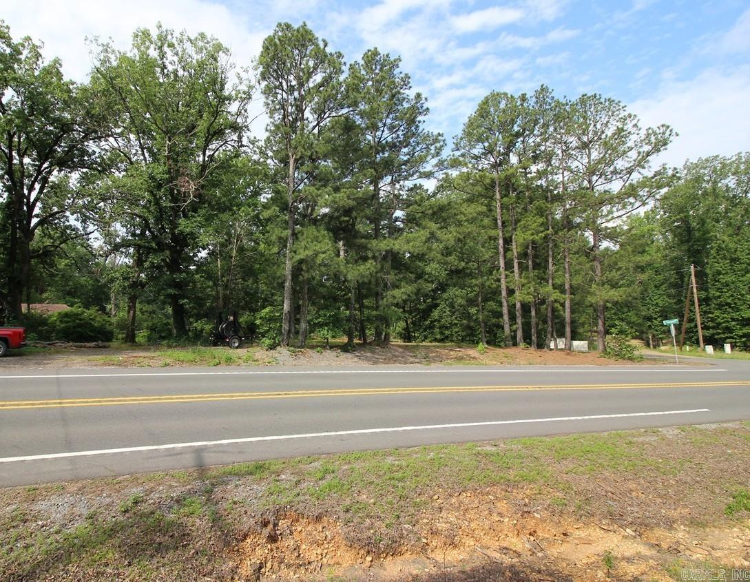 South of Malvern, corner of Hwy 9 & So. Vineyard. Approx. 3.8 miles from Malvern, 3.11 acres MOL. Existing home burned. Home had a well & septic as well as access to city water with Malvern Water Works. Frontage on a shared pond. Detached pavilion. Several large shade trees, gentle slope to the pond, a very nice lawn when mown. Bill of Assurance available upon request. Propane tank owned by seller and does convey.