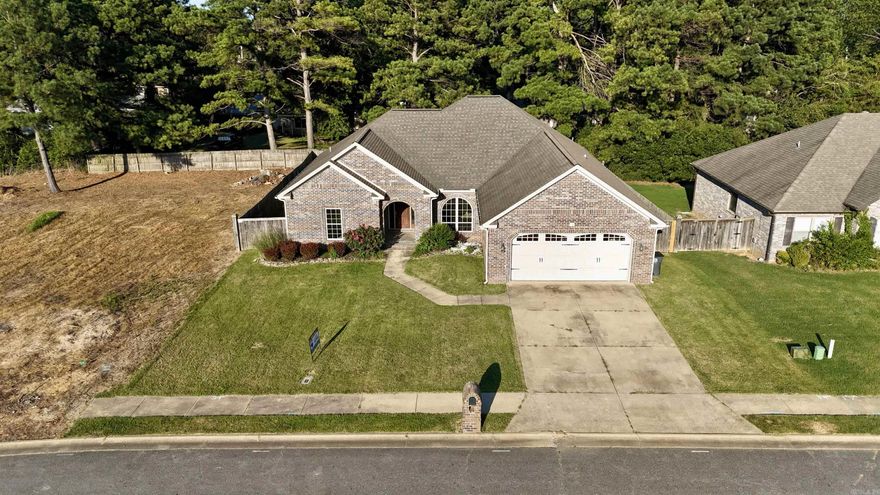 Located in the peaceful Southwind Subdivision of Searcy, Arkansas, this charming 3-bedroom, 2-bathroom, office, home offers 2,335 sq ft of beautifully appointed living space. Inside, you'll find elegant crown molding throughout, adding a touch of sophistication to the open layout. The cozy living area features a fireplace, perfect for relaxing evenings, while the kitchen is thoughtfully designed with a breakfast nook and bar for casual dining. A formal dining room provides an ideal space for entertaining. The master suite is a true retreat, complete with a luxurious jetted tub, stand-up shower, and a generous walk-in closet. The additional bedrooms are spacious and inviting, offering comfort and privacy. Outdoors, enjoy the covered back patio and well-manicured front yard landscaping. The community boasts fantastic amenities, including a swimming pool and pool house, offering residents a relaxing and social environment. Located just minutes from Searcy's local shops, restaurants, and schools, this home provides a perfect blend of comfort and convenience.