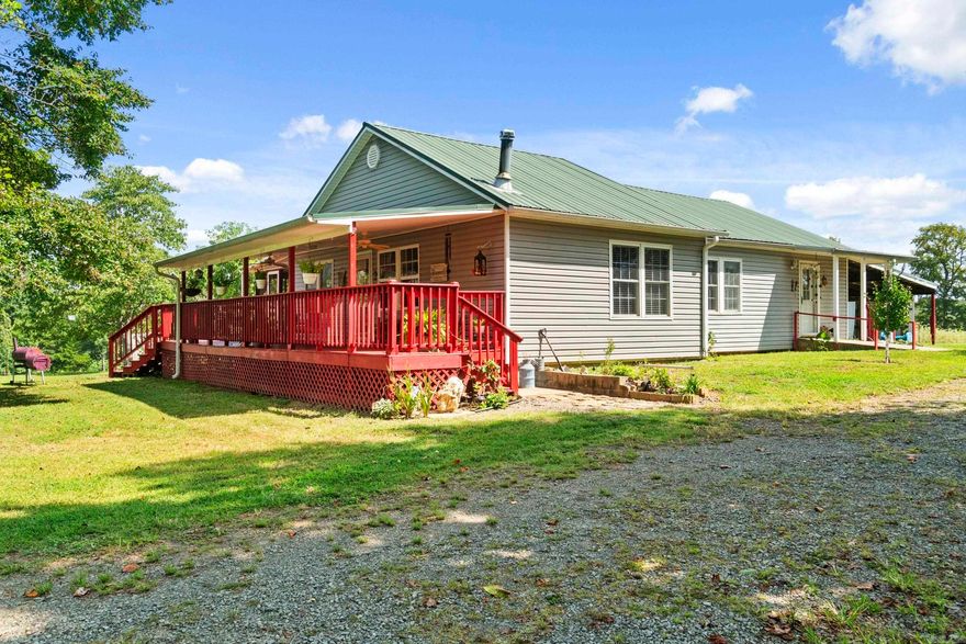 Charming 5-Acre Retreat in Mount Vernon, AR – Creek & Barndominium Escape to serene country living on this 5-acre Mount Vernon property, just a short drive from Greers Ferry Lake for delightful day trips filled with outdoor fun. A year-round creek flows through the land, offering privacy and tranquility, with an additional acre beyond, part of the 5-acre estate, for quiet walks or picnics. Perfect for families, retirees, or hobby farmers seeking a peaceful retreat with modern comforts. The remodeled 1,532 sq ft main home features 3 bedrooms, 2 bathrooms, and a cozy wood-burning stove in the spacious living area, perfect for cozy evenings. Enjoy hardwood/tile floors, an updated kitchen and dining space for family meals, and a large laundry/mudroom for convenience. Unwind on the expansive front porch with rocking chairs for sunset views or the screened-in porch with a fan for relaxed mornings with 1,040 sq ft barndo includes 1 bedroom, 1 bathroom, a kitchen/laundry area, and a large garage with storage, ideal for guests or rentals. Extras include carports for vehicles/RVs, a deep well, fruit trees, a storm shelter, outside storage, and a fenced yard. Mineral rights do not convey.