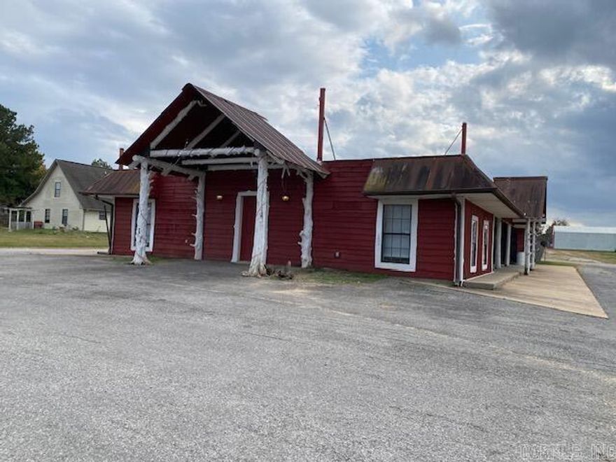 Restaurant building located beside popular Rustic Pines RV Park on busy Hwy 25. Western themed building features 3450sqf. The building features a dining hall, large kitchen area, also bathrooms and an outdoor porch for smoking foods. No equipment is included in this sell. Building could be used for any number of things. Land is coming out of a larger parcel; survey has been completed. Property is agent owned.