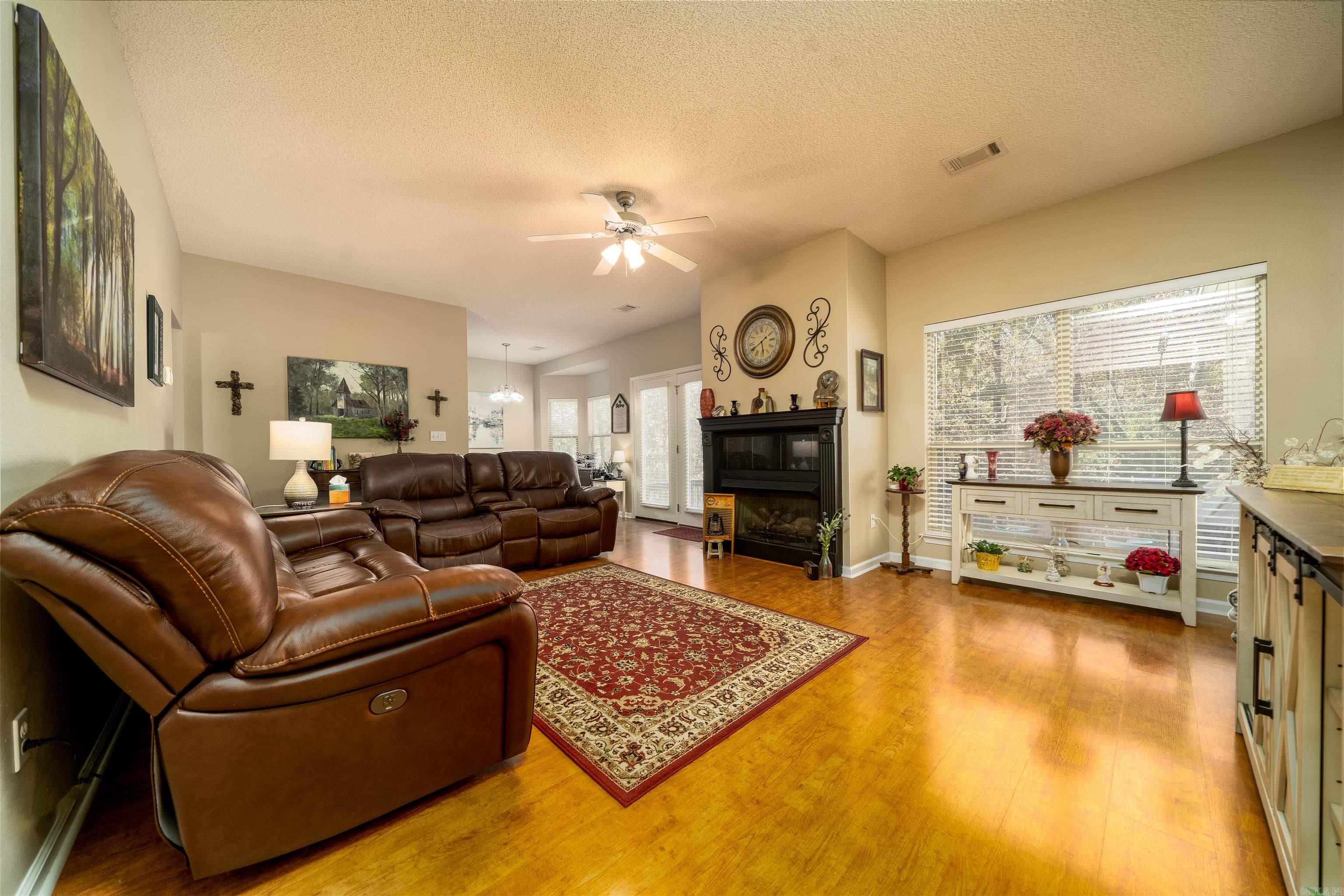 This Beautiful Hot Springs Village Home is ideal for young families or those wishing to downsize! Enjoy convenient golf cart access to the Balboa Golf Course Clubhouse. The kitchen boasts quartz countertops, upgraded appliances, and more. A split floorplan offers privacy for Mom and Dad, while the spacious deck, overlooking a wooded, fenced backyard, is perfect for BBQ's, pets and peaceful relaxation. Additional highlights include a gas log fireplace, hardwood floors, fresh paint, new carpet in the bedrooms and more.