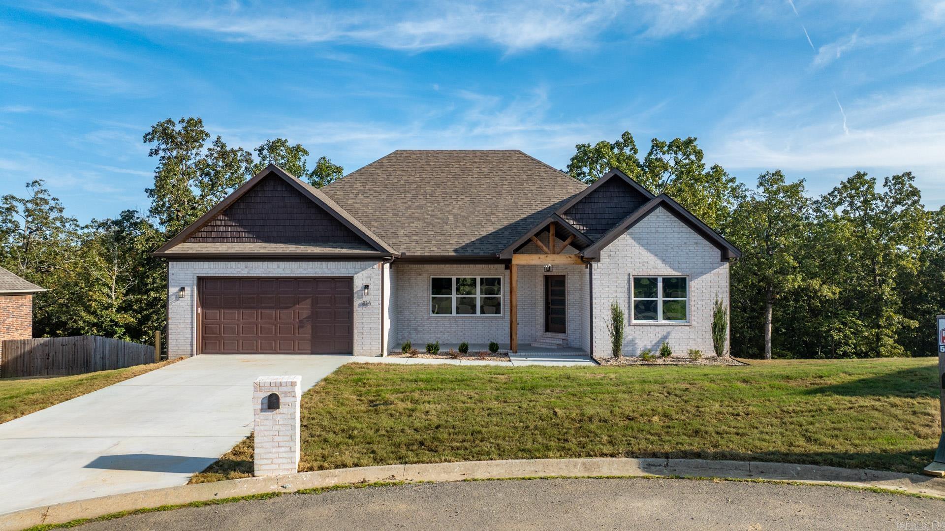 Beautiful 4 bed, 2 bath New construction in a highly desirable subdivision. Featuring modern fixtures, open layout, and serene views of the trees from the covered back porch. Nestled on a quiet cul-de-sac just minutes from the clubhouse and golf course. This house has everything and more! Schedule your showing today because houses like this do not last long!!