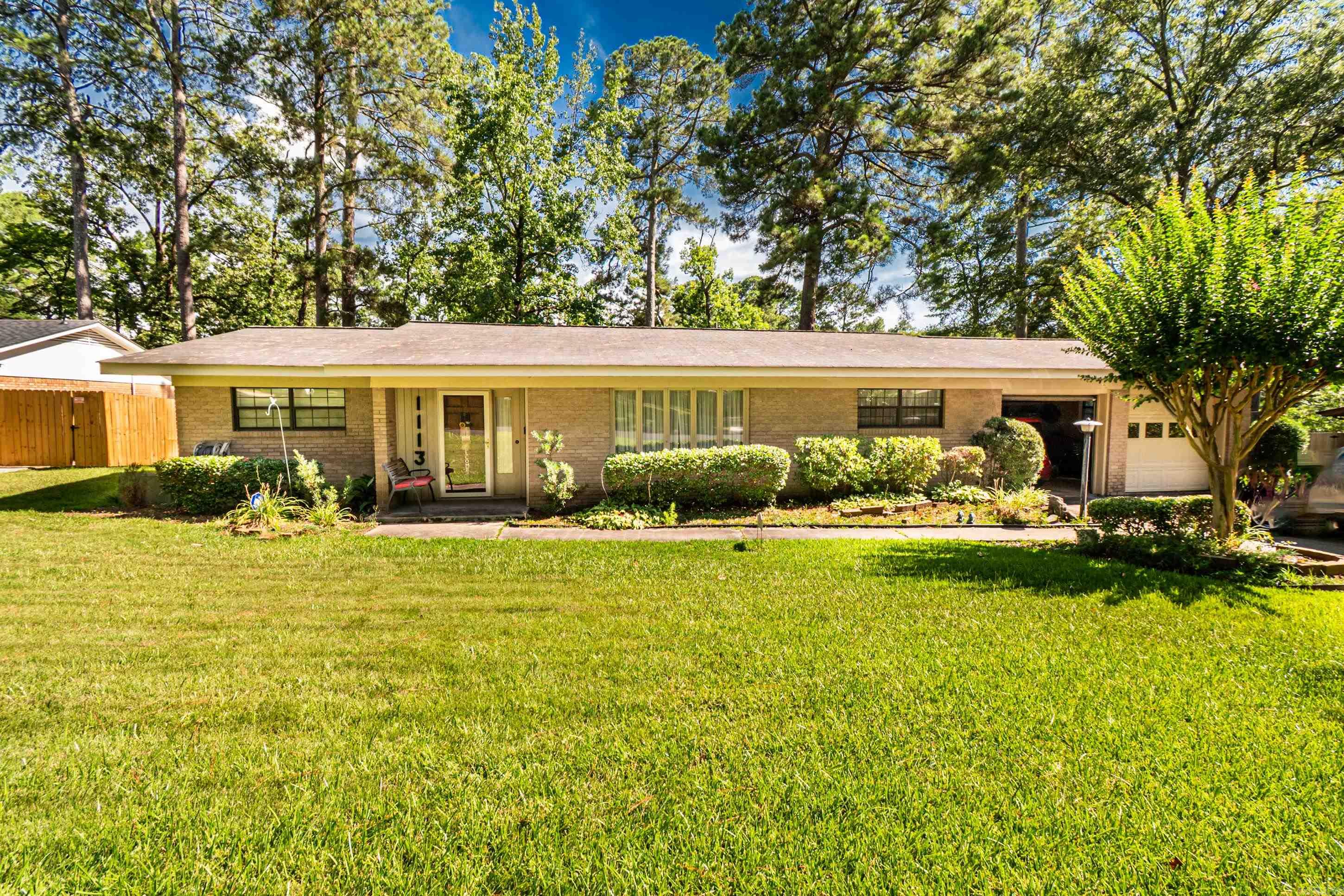 Quiet Racquet Club neighborhood with beautiful landscaping in front and backyard including sprinkler system for both. Spacious glassed in sunroom over looking the backyard. Quartz countertops in kitchen with pull out shelving in cabinets. Master bath offers a walk in shower that is handicap accessible. Washer, dryer, and all kitchen appliances remain. Also includes a whole house generator.