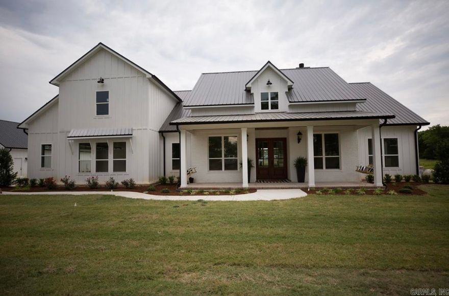 Unbelievable home on 33.6 Acres.  House has amazing features like stone archway, walk in pantry, formal dining room and office.  Covered patio is perfect to enjoy the beautiful acreage with 3 ponds.  30 x 45 shop with attached 600 sq. ft apartment and another 30x 40 shop.