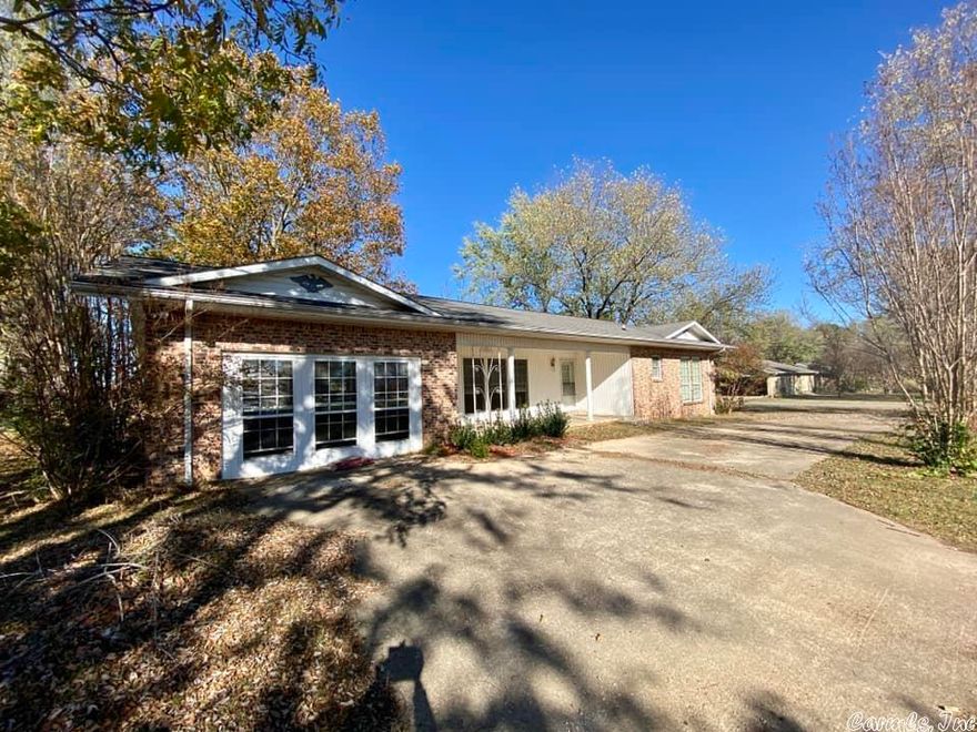 Spacious brick home ready for you and your family to move into! 3-bedroom 2 bath with a large separate utility room just off the kitchen. Large living room with beautiful large windows to see the outside surroundings and partial mountain views. Back deck as well as a storm shelter just off the back deck and an outbuilding that will convey.  Close to town and within a couple of miles of the White River.