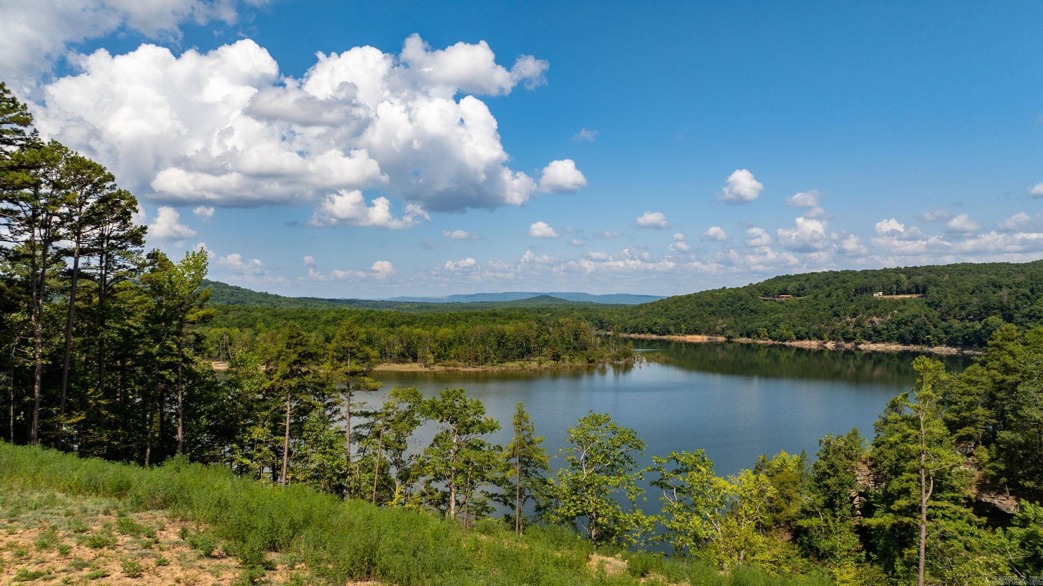 Beautiful lake front lot with breathtaking view of Greers Ferry Lake! There are total of four lots. Two on the lake totaling 1.12 acre, and two across the street totaling 0.97 acre. All 4 lots are being sold togther, totaling 2.08 acres. It's a perfect opportunity to build property on the lake and a shop across the street. Private neighborhood boat launcing pad within a few minutes of the property. Perfection!!