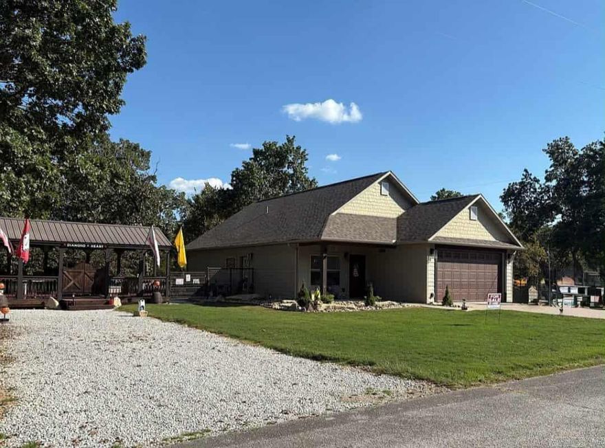 Heavy duty fence, oversized 2 car garage, beautifully landscaped exterior, oversized walk in shower, 3 driveways, open floor plan, cellulose insulation. 2 short blocks to the boat ramp at the Lead Hill Boat Dock (Sugarloaf Harbor Marina) on Bull Shoals Lake. Owners call the home, "Diamond Heart", unique property on the ridgeline combining 3 lots with a fence around the perimeter & incorporating a "Dirksen" 12'x24' Cabana into the fenceline for entertainment & relaxation. Inside the home is a kitchen with stainless steel appliances & pantry, master bedroom with a walk in closet, covered front porch, 2"x6" exterior walls, 9' ceilings, exterior materials are "smart siding" (wood composite) & cultured stone. 3rd parcel is fairly flat & would make a great location for a large shop.