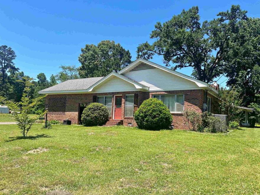 Charming Country Property on 5 Acres – Sold AS IS This unique property offers 2 bedrooms and 2 bathrooms, plus a versatile bonus space currently used as an additional bedroom. The inviting front entrance doubles as a sitting room or sunroom, perfect for relaxing. Inside, you’ll find a cozy den/family room with a fireplace, an eat-in kitchen, and a separate formal dining room. A step-down bonus living area adds even more flexible space for entertaining or everyday living. Situated on approximately 5 peaceful acres, the property features a pond and a large workshop with two separate areas-- equipped with concrete slabs. Additional amenities include a 2-car carport and large yard with fruit trees ideal for enjoying the outdoors. Sold AS IS.