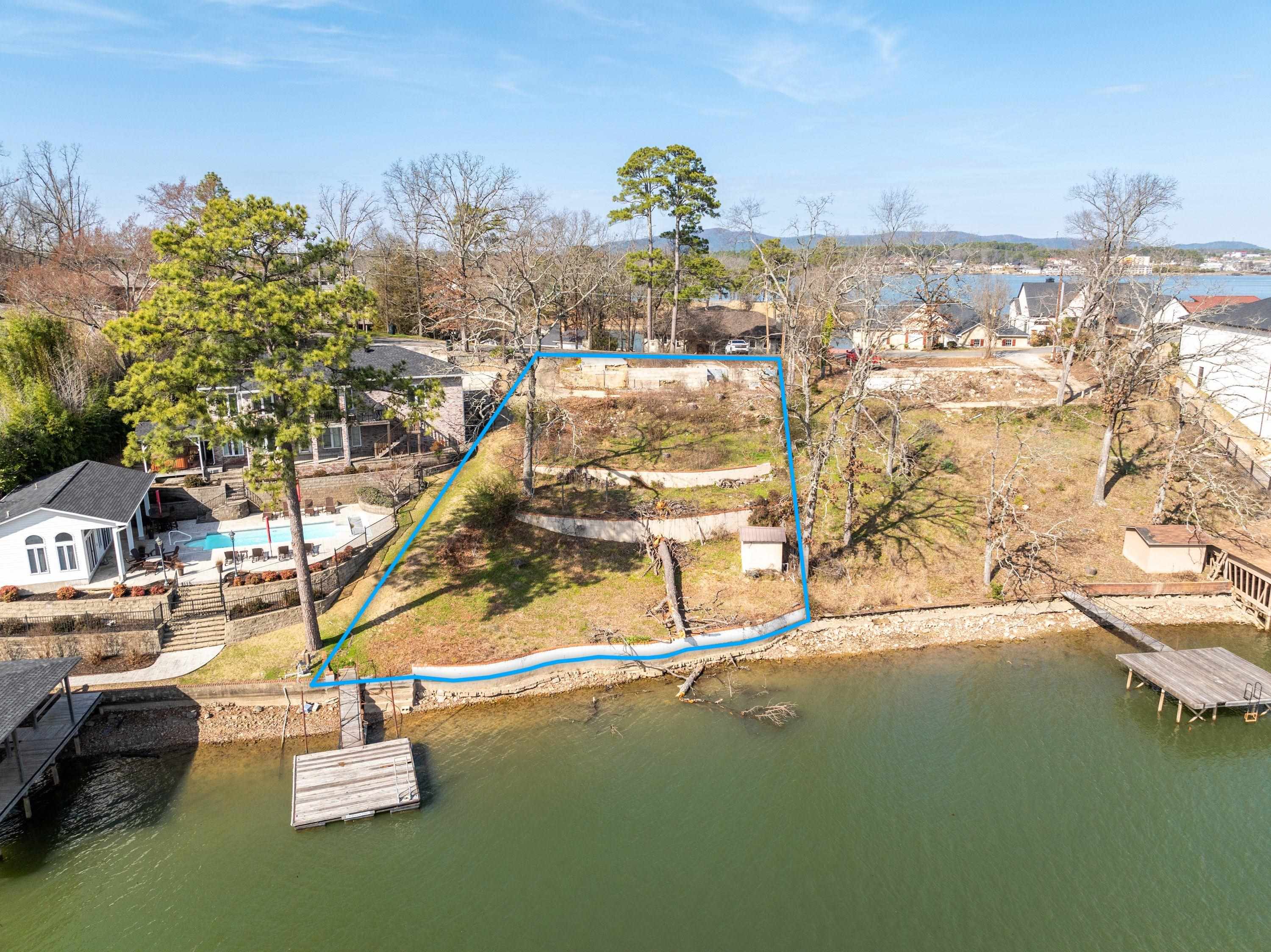 Beautiful lake lot ready for you to build your dream home! Year round water on Lake Hamilton, city utilities available, sea wall in place, swim dock, boat dock permit, and survey. Great location, 10 minutes to all amenities that beautiful Hot Springs has to offer!