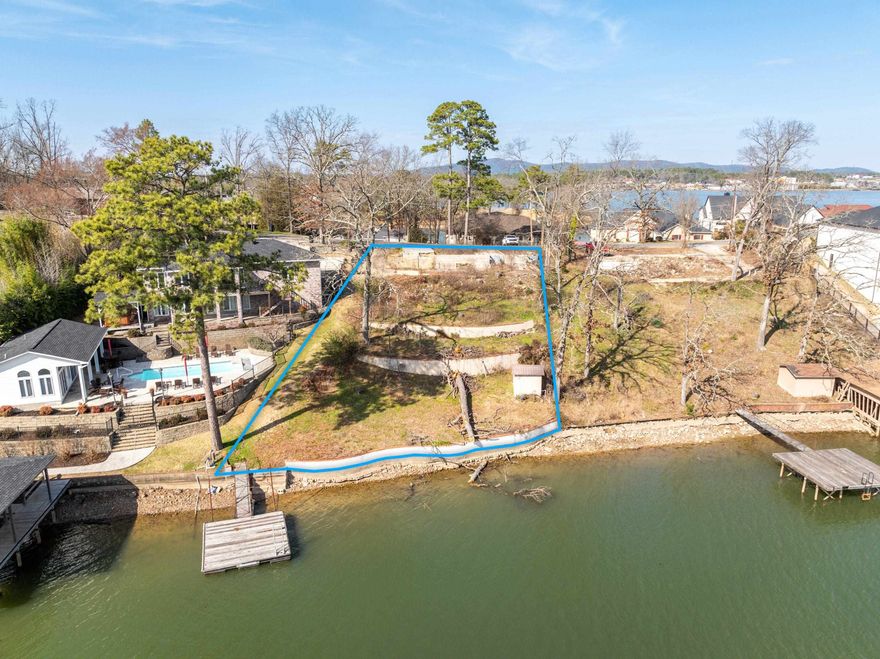 Beautiful lake lot ready for you to build your dream home! Year round water on  Lake Hamilton, city utilities available, sea wall in place, swim dock, boat dock permit, and survey. Great location, 10 minutes to all amenities that beautiful Hot Springs has to offer!