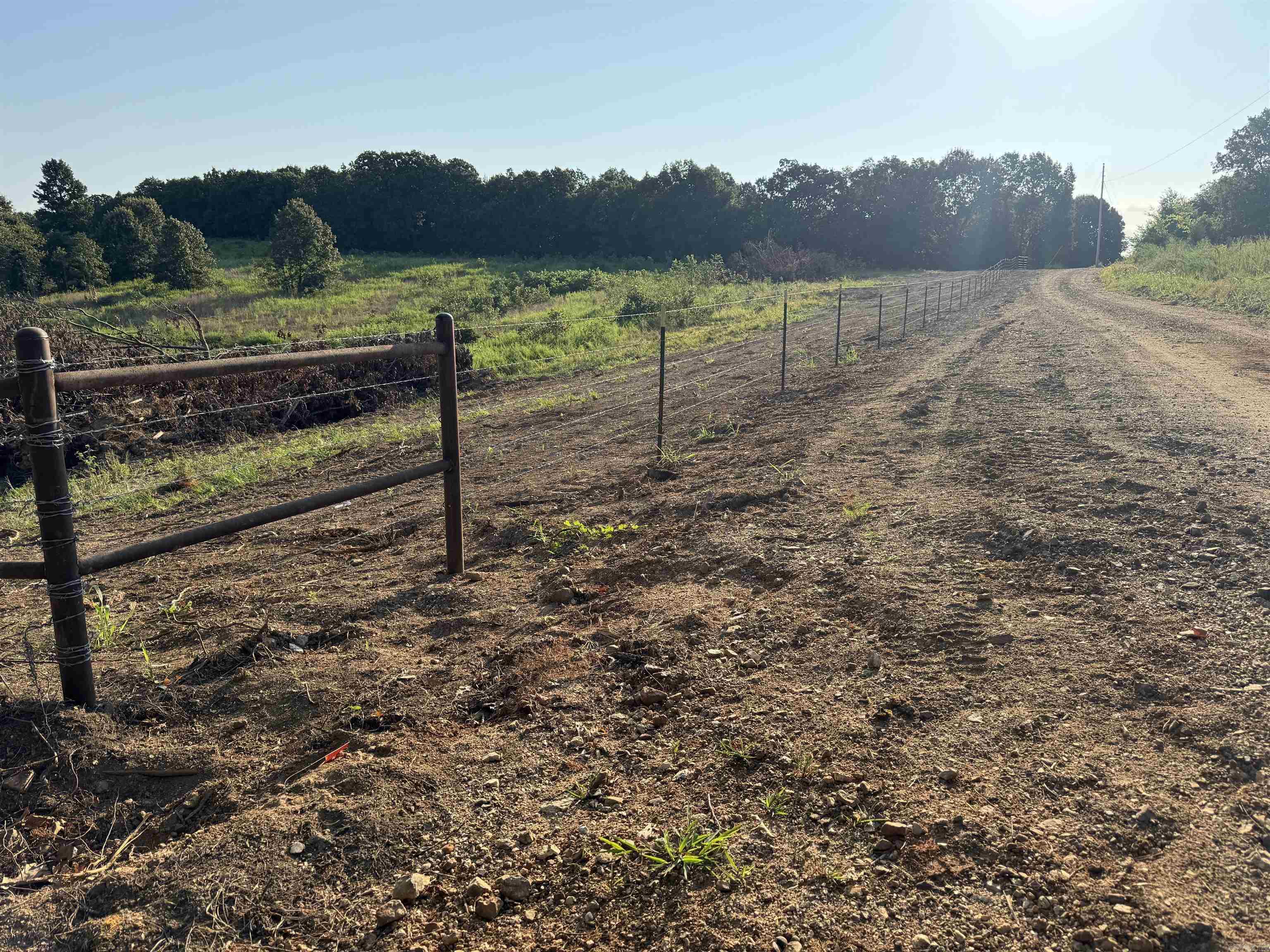 Welcome to the market 75+/- Acres of versatile-use acreage in Fulton County, Arkansas! This exceptional piece of property offers a rare blend of functionality and natural beauty and is located in the heart of Fulton County. Previously used as a cattle grazing operation, the land is primarily open pasture with scattered timber, making it ideal for a variety of uses. This property also features a pond that would be ideal for grazing animals to drink with a natural draw to wildlife. The wildlife is abundant, with regular sightings of deer, turkey, and quail, presenting excellent recreational and hunting opportunities. Two small ponds add both a dependable water source for livestock or wildlife. Whether you're looking to continue agricultural use, create a private hunting retreat, or build your dream home in a peaceful rural setting, this property delivers the space and potential to make it happen. Don’t miss your chance to own a truly multi-use tract in a beautiful part of Arkansas. Price is $3,250.00 per Acre. Exact Acreage is to be determined by new survey that is in progress.