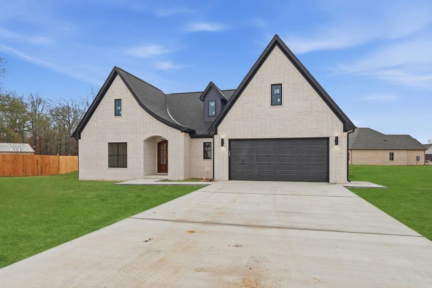 Stunning New Construction Home by Jim Atkinson Construction in Greenbrier’s newest subdivision East Meadows. Discover your dream home in this beautifully crafted new construction. This exquisite property has four spacious bedrooms, or 3 bedrooms and office and two modern bathrooms. Home is a split and open floor plan. Separate dining room or flex room. Kitchen the heart of the home features gleaming granite countertops and high-end stainless steel appliances, perfect for culinary enthusiasts. Enjoy the luxury of a master bedroom complete with walk-in closets, a soothing soaking tub, a custom-tiled shower, granite countertops, and dual sinks. Additional Amenities: separate laundry room adds convenience, lockers/mud room meet after going in the house from garage, while the electric fireplace creates a cozy ambiance for relaxation. Energy Efficiency: The property is all-electric, ensuring modern energy efficiency. A covered back porch offers a wonderful space for outdoor entertaining or unwinding in privacy.