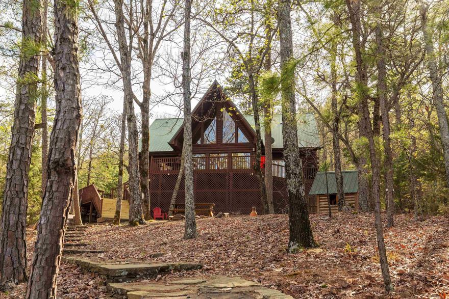 Experience the best of Greers Ferry Lake living in this inviting 4 bedroom, 4 bath log-style lake home. Designed with both comfort and entertaining in mind, the home features a spacious living area with vaulted ceiling and windows that frame beautiful lake views. A large lakeside deck provides enjoyable outdoor living space, perfect for relaxing or hosting guests. The lakefront lot features excellent white line frontage and includes a Corps of Engineers-permitted private path to a beach shoreline. A garage offers convenient storage for lake toys and equipment. Most furniture and furnishings are available to convey.