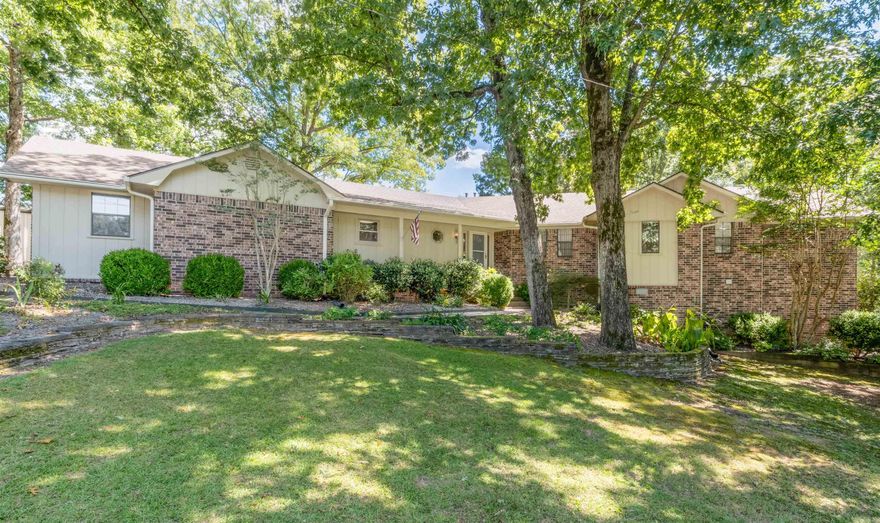 Tucked into a peaceful community, this beautiful country home offers serenity & convenience. Located 20 minutes from central Little Rock in the NE corner of Saline County, this home with 2.7 acres+/- provides an ideal layout for both family living & entertaining. With 2,746+/- sq. ft. of thoughtfully designed living space, there’s room for everyone to spread out with 2.5 bathrooms, 3 bedrooms, & a beautifully finished basement that could be a fourth bedroom.   Inside, the home features luxury vinyl flooring & plush carpet, complemented by tile in the kitchen & bathrooms. The kitchen features beautiful cabinets & striking countertops, blending functionality with elegance, while the layout flows seamlessly into the living area. A gas-insert fireplace adds warmth & charm, creating the perfect space to gather with loved ones.  Step outside to the picturesque backyard overlooking a private, stocked lake. Whether enjoying a morning coffee on the deck, tending to the well-cultivated garden space, or relaxing under the shade of mature trees, this property makes every day feel like a retreat.  Practical touches include outbuildings for storage, a dedicated dog kennel and a two-car garage.