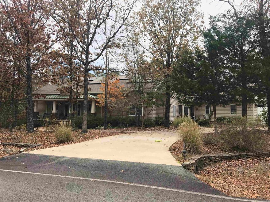 If you are looking for a beautiful home with a natural woodland setting, this could be for you! With approx. 2700 sq. ft., you'll enjoy a dream kitchen with granite countertops, stainless appliances, walk-in pantry, custom cabinetry with pull-out spice racks, recycle center, all in an efficient work triangle with huge island.  The kitchen is open to the greatroom that has a ventless gas fireplace & lots of windows that show off the back deck & a view of the lichen-covered rocky back yard, & valley view beyond back edge.  You can also see the more formal dining area & wet bar.  The 3 BR split design allows comfort & privacy in the Master BR suite which is connected to the laundry room, which has a sink,  front-load W/D, & room for an upright freezer.  The other 2 BR have walk-in closets & share a guest Ba are tucked away from the kitchen. The flooring in these areas are wood & tile.  You'll love the sun porch with concrete floor, floor to ceiling windows, & a minisplit.  The house is 1 level & handicap accessible from garage/shop to rear entry. Extra unique features:  enclosed crawlspace, high insulation rating with SIPS; solar panels, wired for generator.  Too many details to list!