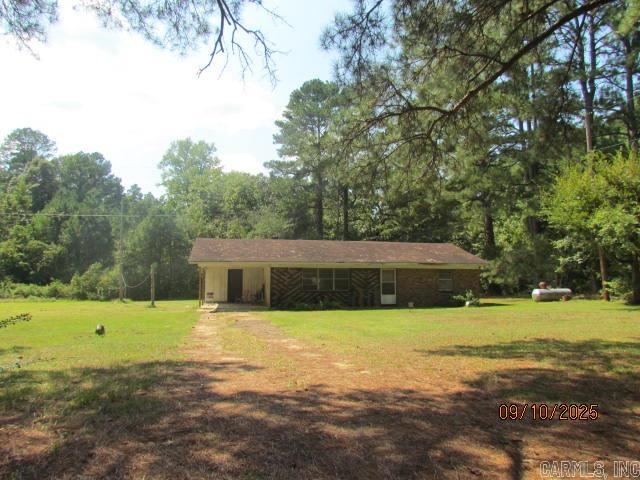 House to be sold as is, great investment for rental property. Living/dining area open to kitchen, full bath, two bedrooms, laundry room off carport. House is sitting on a 1.01 A lot in Fountain Hill, AR. Needs flooring, painting, hot water heater, central unit. Do not know condition of roof.