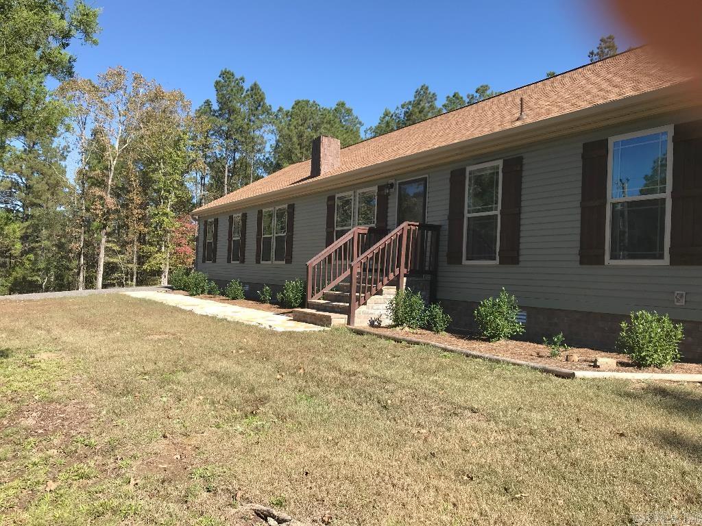 Country living. 11.4+/- acres! Immaculate inside. Manicured w/flowing creeks. Live off beaten path or develop many potential home sites. Workshop shed. Laundry entry, peaceful back porch, established fig, peach, pear & apple trees, well w/softener & filter. Library à potential 4th bed. Kitchen island w/power. Cabinets solid wood & soft-close. Quiet. Minutes from Caddo River, Lakes Greeson, De Gray, Ouachita & Hamilton. Near Hot Springs, but far enough out to enjoy peace & quiet. No neighbors adjacent lots.