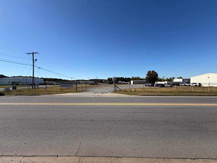 Welcome to this wonderful partially fenced approx. 1 acre commercial lot!  This property features a secure for easy access an a gravel surface, providing both convenience and functionality.  Ideally located close to the interstate for great accessibility.  Surrounded by thriving industrial businesses and a variety of nearby dining options, this lot is perfect for your next commercial venture.  Agents see associated documents