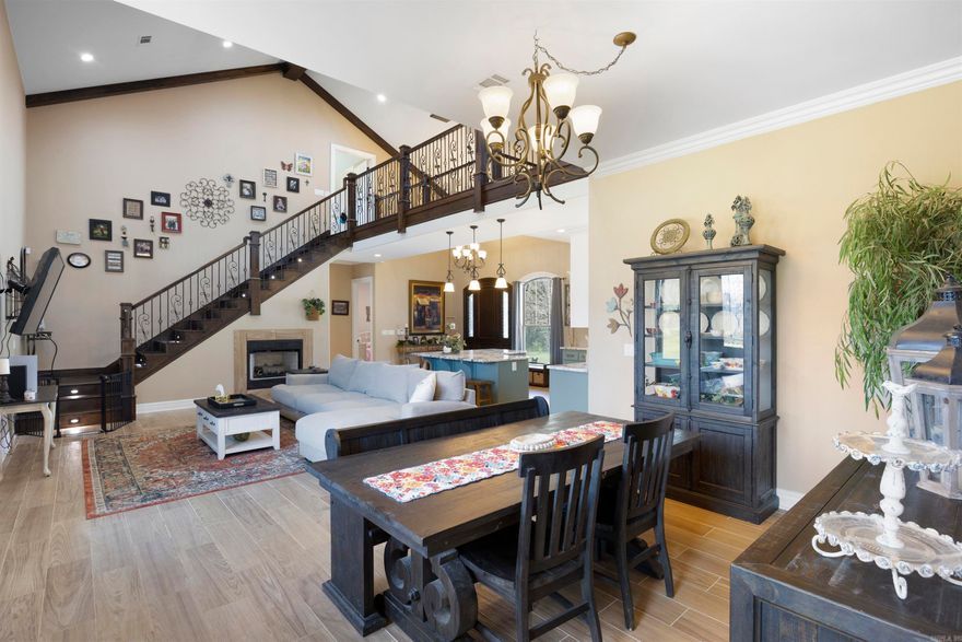 This stunning 4-bedroom, 3-bath custom home truly has it all! Built in 2022 with top-tier craftsmanship, you’ll fall in love with the open floor plan, soaring 23-ft vaulted ceilings in the living room, and 12-ft ceilings throughout the rest of the home. The kitchen is a chef’s dream featuring custom cabinetry, gorgeous granite countertops, and solid wood exterior doors that add charm and character. The huge master suite is a luxurious retreat with a spa-like double-head walk-in shower and a closet fit for royalty. The show-stopping staircase adds elegance to the main living space, perfectly blending form and function. This home was constructed as a Passive Home, meaning it’s designed for maximum energy efficiency and comfort. With superior insulation, air sealing, and high-performance windows and doors, Passive Homes drastically reduce energy use and maintain consistent indoor temperatures year-round—saving you money while keeping your home ultra-comfortable.