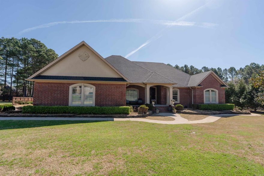 Luxury estate home offering over 3100 sqft with 4bed, 2.5 baths, and high-end finishes throughout. This move-in-ready home features beautiful wood flooring, granite countertops, extensive crown molding, and a soaring tray ceiling in the spacious living room. The gourmet kitchen is equipped with double ovens, a built-in ice machine, ample cabinetry, and generous counter space perfect for entertaining. The split floorplan with large bedrooms and walk-in closets provides a functional layout for families. Enjoy outdoor living on the covered patio overlooking a private backyard- ideal for relaxing, grilling, or hosting guests. Located in the prestigious Club West Estates, this home combines luxury, space, and convenience to everything Searcy has to offer!