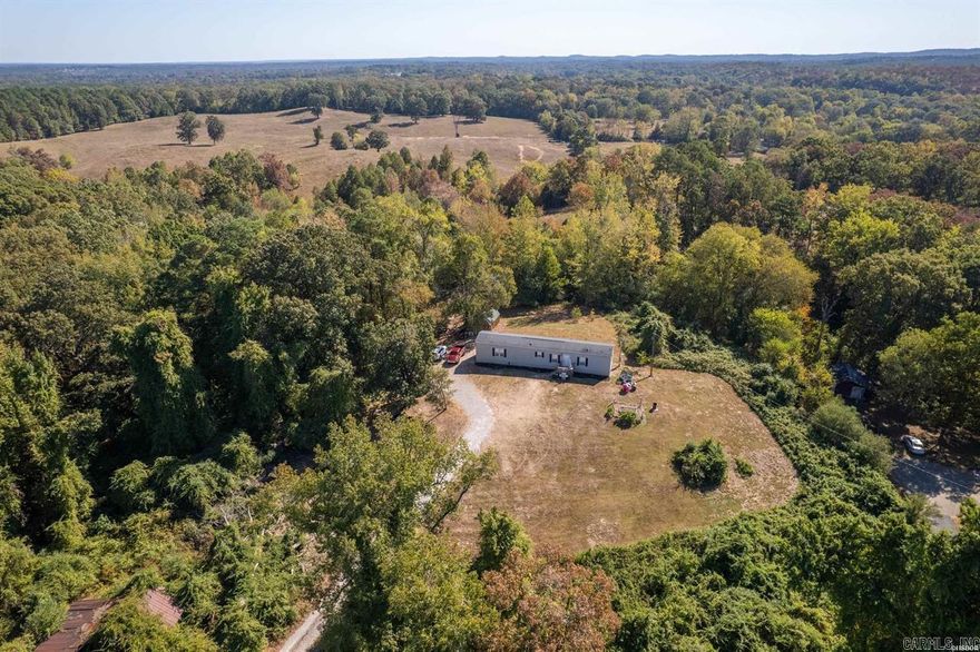 This peaceful country property offers the best of both worlds — tucked away in a quiet country setting away from the hustle and bustle, and close to the city. Conveniently located just off Highway 70 just 15 minutes from Hot Springs and Benton/Little Rock  Sitting on 5.92 acres and includes a charming 3-bedroom, 2-bath home nestled on the hilltop, a rental home, and an additional home site with its own septic and water connections. The rental home is currently rented, and the renter takes care of all mowing and some property maintenance — making this a fantastic income-producing setup.  The main home features a beautifully updated farmhouse style with newer cabinets, fixtures, flooring, and fresh paint throughout. The primary suite includes a walk-in closet, double vanity, and relaxing soaker tub.  The property has a small pond on it, and is within walking distance to a family park. Don’t miss this great investment opportunity!