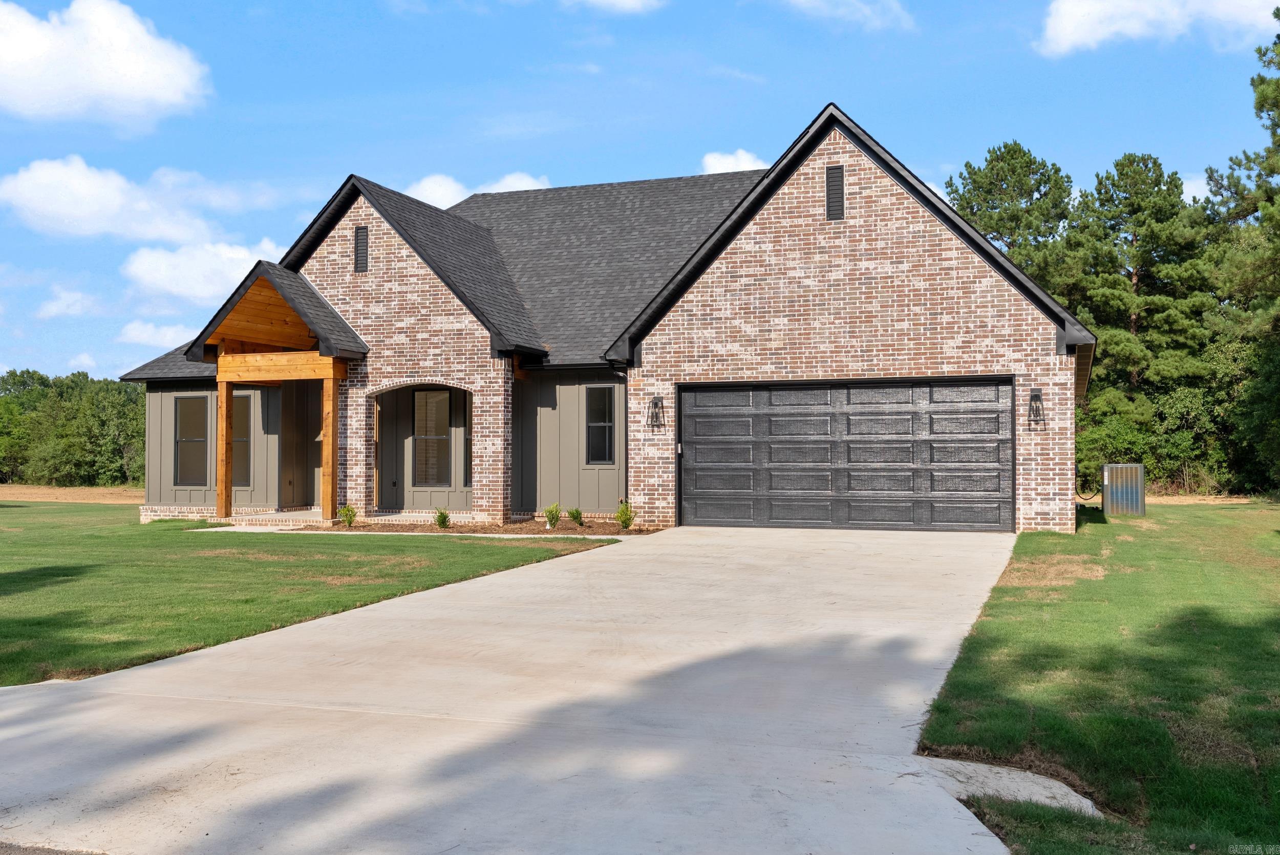 This 4-bedroom, 2-bath home with an office sits on a large lot in Greenbrier. The kitchen includes quartz countertops and custom lighting. A fireplace is the focal point of the living area. The home also features a covered back porch and a spacious yard, offering plenty of room for outdoor activities.