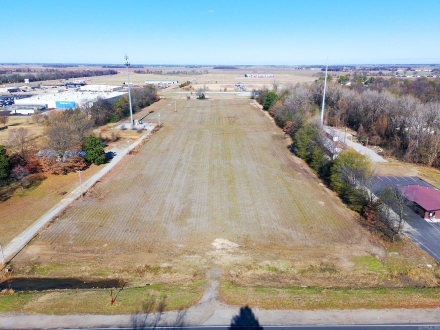 Excellent development opportunity located just off Hwy 555, 4.58 +/- acres positioned near popular fast-food restaurants, gas stations, and local retail. This raw land tract offers outstanding visibility and convenient access, making it ideal for commercial, service, or mixed-use projects. Situated only 45 minutes from Memphis, TN, and just 15 minutes from Jonesboro, AR, the property benefits from strong regional traffic and steady growth. Located within the city limits, the site has access to local utilities, streamlining future development. Whether you're looking to build a retail center, restaurant, or service-based business, this strategic location provides the exposure and accessibility you need. A rare chance to secure valuable highway-side commercial land in a rapidly developing corridor.