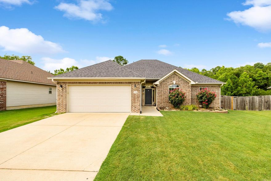 Welcome to this well-maintained 3 bed, 2 bath home in desirable King’s Crossing. Featuring a split floor plan and durable vinyl flooring throughout—no carpet in sight—this home blends comfort, charm, and functionality. The spacious primary suite offers dual vanities, double walk-in closets, a large soaking tub, and a walk-in shower. The kitchen includes beadboard cabinetry, stainless steel appliances, and opens to a cozy dining area. Enjoy a large laundry room, a fully fenced backyard backing up to green space, and a covered patio perfect for relaxing or entertaining. Located in the Bryant School District with easy access to I-30, Benton, Bryant, and Little Rock!!